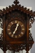 An antique German Black Forest cuckoo and quail wall clock, attributed to JOHANN BAPTIST BEHA, 30-hour duration wood plate movement, carved walnut station house style case with decorative pierced scroll leaf and vine decoration, bone hands and applied Rom - 2
