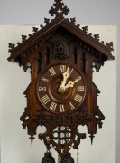 An antique German Black Forest cuckoo wall clock by JOHANN BAPTIST BEHA, model 361, with wood plate movement, carved and fretted Gothic influence lindenwood case with carved bone hands and Roman numerals, circa 1860, the case 43cm high, 27cm wide. - 2