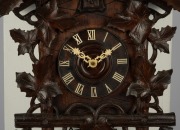 An antique German Black Forest cuckoo wall clock in carved case with vine leaf decoration and cuckoo finial. Fancy fretted and carved bone hands, plus Roman numerals. 30 hour brass plate movement striking the hour and half hour on a coil gong, circa 1890, - 3