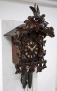 An antique German Black Forest cuckoo wall clock in carved case with vine leaf decoration and cuckoo finial. Fancy fretted and carved bone hands, plus Roman numerals. 30 hour brass plate movement striking the hour and half hour on a coil gong, circa 1890, - 4