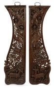 A pair of Chinese carved wooden panels, adorned with birds and antelope, 20th century, 118cm x 33cm.