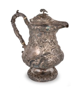 An antique sterling silver hot water pot with ornate floral repousse decoration, 19th century, 28cm high, 1,253 grams.