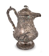 An antique sterling silver hot water pot with ornate floral repousse decoration, 19th century, 28cm high, 1,253 grams.