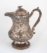 An antique sterling silver hot water pot with ornate floral repousse decoration, 19th century, 28cm high, 1,253 grams. - 2