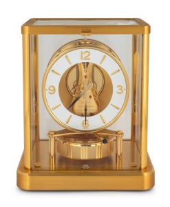 JAEGER LECOULTRE "ATMOS" table clock (calibre 540), in gilt brass case, with skeletonized movement, white chapter ring, baton numerals, 23cm high.