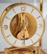 JAEGER LECOULTRE "ATMOS" table clock (calibre 540), in gilt brass case, with skeletonized movement, white chapter ring, baton numerals, ​​​​​​​23cm high. - 2