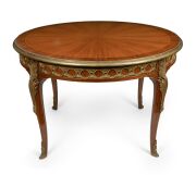 A fine quality French Louis XV style four leaf extension dining table, handsomely crafted in kingwood and amaranth with tulipwood cross-banding and ormolu mounts, mid 20th century, A/F, 78cm high, 121cm diameter (273cm extended).