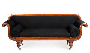 An early Colonial double scroll cedar settee, Australian, early 19th century on shaped baluster feet, upholstered in black woven wool97cm high, 230cm wide and 65cm cm deep