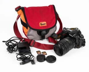 NIKON D750 FX digital SLR camera with a 28-300mm VR lens, battery charger, cables and bag.