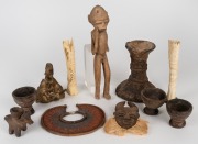 Assorted tribal ornaments, pottery vessels, bronze statue, carved bone etc., African origin, 20th century, (11 items), the largest 28cm high.