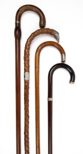 Four assorted antique and vintage walking sticks with silver collars or caps, 19th/20th century, the largest 91cm high.