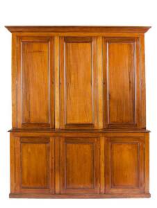 Colonial cedar bookcase comprising 3 upper doors & 3 lower doors all panelled in solid cedar, c1870. Height 243cm, width 204cm, depth 54cm