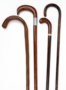 Four assorted vintage walking sticks, including blackwood and palm wood shafts, 19th/20th century, the largest 92cm high.