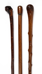 Three assorted walking sticks with blackthorn and timber shafts, 19th/20th century, the largest 90cm high.