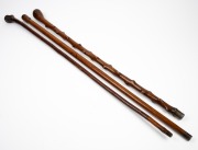 Three assorted walking sticks with blackthorn and timber shafts, 19th/20th century, ​​​​​​​the largest 90cm high. - 2