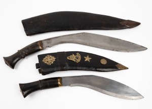 Two Nepalese Gurkha knives in leather scabbards with horn handles, early to mid 20th century, 45cm long.