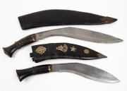 Two Nepalese Gurkha knives in leather scabbards with horn handles, early to mid 20th century, 45cm long.