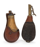 An antique leather and brass shot flask; together with an embossed copper and brass powder flask in original leather holster, 19th century, (2 items), the larger 22cm high. - 2
