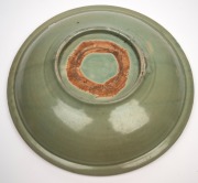 An impressive antique Chinese celadon glazed charger, Yuan/Ming Dynasty, displayed on an antique huanghuali stand, 44.5cm diameter. - 3