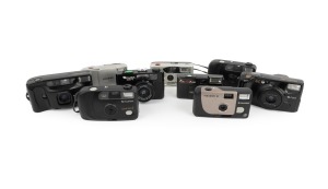 FUJICA/FUJIFILM: Group of 1980s-90s plastic point-and-shoot cameras, comprising Clear Shot II (2), DL-180 Tele Date, DL-1000 Zoom, Fotonex 210ix Zoom, Fotonex 10, MA-1, Nexia 20 Auto, and Pocket Fujica 450 Flash. (9 items)