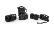ASAHI KOGAKU: Group of 1990s plastic point-and-shoot cameras, comprising Pentax Espio 140 (with case), Pentax PC35 AF-M, Pentax PC-50 AF, and Pentax Zoom 70-R. (4 items)