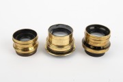 TAYLOR, TAYLOR & HOBSON: Group of late-19th century Cooke brass lenses with iris diaphragms, comprising Series III 6&frac12; x 4&frac34; Equifocus, Series III 7&frac12;" f6.5, and Series VII.A 8&frac12; x 6&frac12; Primoplane. (3 items) - 2