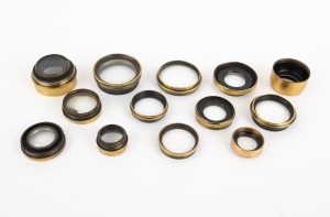 VARIOUS MANUFACTURERS: Group of late-19th century brass lens elements; the widest 52mm. (13 items)