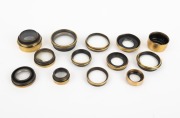 VARIOUS MANUFACTURERS: Group of late-19th century brass lens elements; the widest 52mm. (13 items)
