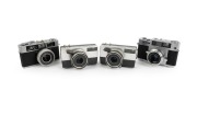RICOH: Group of 1960s rangefinder cameras, comprising Ricoh 35S, Ricoh Auto 35 (2), and Ricoh 500. (4 items)