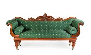 SETTEE: A fine Colonial cedar double ended settee c1840s. Elaborately carved Thomas Hope back, scrolling arms all resting turned & reeded legs. Upholstered in a tasteful green fabric with woven gold stars. Height 106cm, width 225cm, depth 65cm