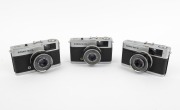 OLYMPUS: Three c. 1960s Olympus Trip 35 viewfinder cameras with D. Zuiko 40mm f2.8 lenses.
