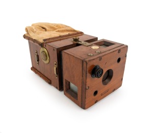 Detective-type magazine camera, c. 1890s, with integrated changing bag, waist-level finder, plate counter, tripod socket, and "W. Watson & Sons - 78 Swanston St. Melbourne" retailer's inlay.