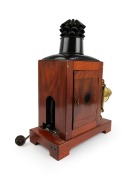 Large c. 1890s mahogany and brass MAGIC LANTERN with rack-and-pinion lens, tin chimney element, side-opening door with red glass peephole; engraved to front plate "T. Gaunt, Optician, Melbourne" (official watchmaker and optician to the Governor of Victori - 2