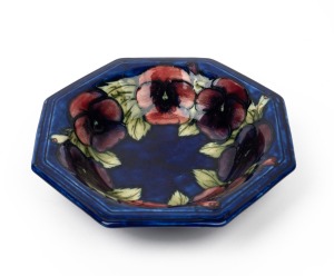 MOORCROFT "Pansy" octagonal pottery fruit bowl on blue ground, impressed "Moorcroft, Made In England" with underglazed blue initials "W.M.", 25cm wide.