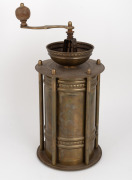 An antique Austrian brass coffee grinder adorned with hand-painted porcelain panel, 19th/20th century, ​​​​​​​36cm high overall. - 2