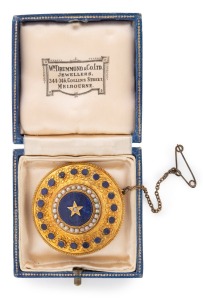 An antique 18ct gold circular brooch adorned with seed pearls, diamond and lapis lazuli, mid 19th century, 4cm diameter, 12.3 grams total.