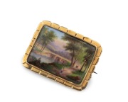 An antique hand-painted enamel brooch mounted in 15ct gold, 19th century, ​​​​​​​4.5cm wide, 10.2 grams total.