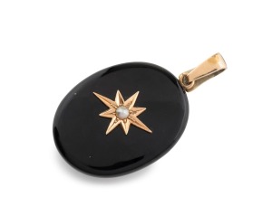 An antique 18ct gold mourning locket with black enamel finish, 19th century, 5cm high overall including bow, 13.7 grams total.