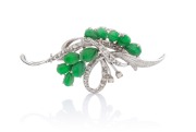 An impressive 18ct white gold and jade cocktail brooch, circa 1950s, ​​​​​​​6cm wide, 9.4 grams.