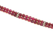A stunning 18ct gold bracelet adorned with two rows of cabochon rubies interspersed with bands of white diamonds, early to mid 20th century, ​​​​​​​18cm long, 27.2 grams total. - 2
