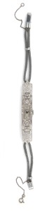 A stunning Art Deco ladies cocktail evening watch, crafted in dazzling white platinum and white diamonds, housed in original silk lined box, circa 1925.