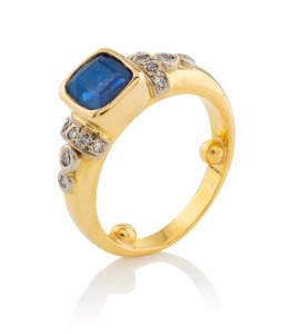 A vintage 18ct gold ring, set with a handsome blue sapphire and white diamonds, 20th century, stamped "18ct", 11.3 grams total.