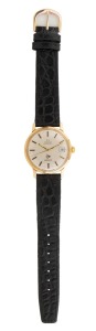 OMEGA automatic wristwatch in 9ct solid gold case with baton numerals and date window, branded on the dial for the company Dunlop, bearing inscription from Dunlop verso to an employee in recognition of twenty-five years of employment, 38mm wide including crown, back cap weight 7.2 grams.