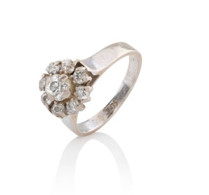 A vintage white gold and diamond floret cluster ring, early to mid 20th century, ​​​​​​​5 grams.