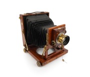 THORNTON-PICKARD: "College" triple-extension view camera, c. 1912, plate dimensions 16.5 x 12cm (glass absent), uninscribed brass lens with iris diaphragm, Thornton-Pickard roller-blind shutter.