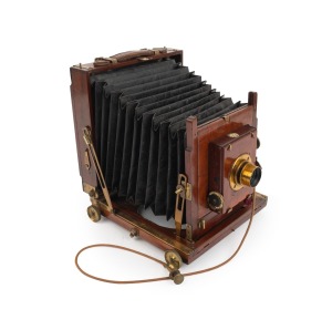 THORNTON-PICKARD: "Ruby" triple-extension view camera, late 19th century, plate dimensions 12 x 16.5cm, Taylor, Taylor & Hobson Cooke Series V 4&frac14; x 3&frac14; 5-7" brass lens, Thornton-Pickard roller-blind shutter, "Antinuous" shutter release.