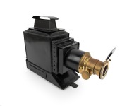 MAGIC LANTERN: Black-lacquered tin body, brass rack-and-pinion lens, c. 1900s; dimensions approx. 42 x 13 x 30cm.
