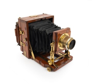 LANCASTER: "Instantograph" view camera, late-19th century, plate dimensions 10.5 x 8cm (glass absent), iris diaphragm brass lens engraved "J. Lancaster & Sons", "Sharp & Hitchmough, 101 & 103, Dale Street, Liverpool" retailer's plate.
