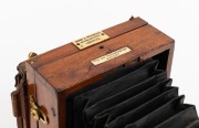 LANCASTER: "Instantograph" view camera, late-19th century, plate dimensions 10.5 x 8cm (glass absent), iris diaphragm brass lens engraved "J. Lancaster & Sons", "Sharp & Hitchmough, 101 & 103, Dale Street, Liverpool" retailer's plate. - 2