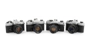 FUJICA: Group of 1970s SLRs, comprising ST605 (Super-Takumar 55mm f1.8), ST701 (Fujinon 55mm f1.8), STX-1 (X-Fujinon 55mm f2.2), and STX-1N (X-Fujinon FM 50mm f1.9). (4 items)